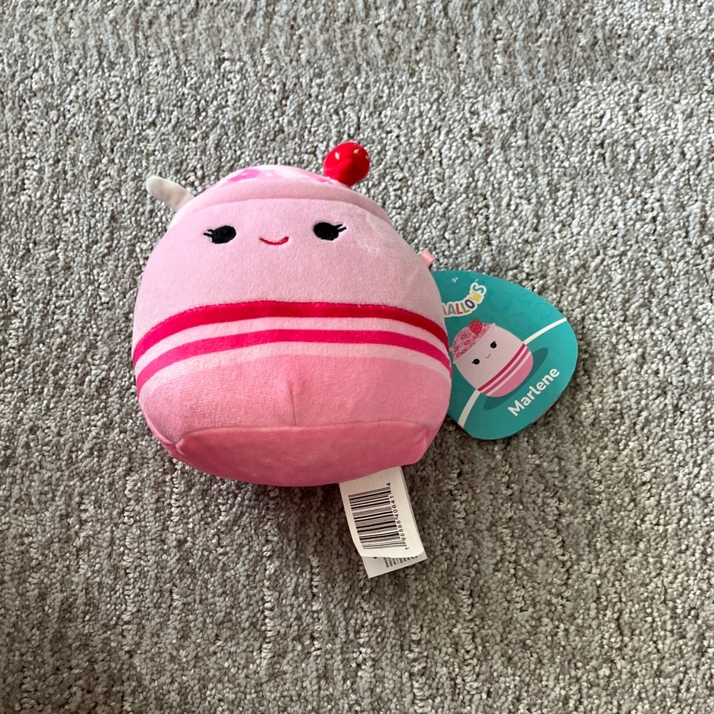 Squishmallows Pink and Red Stuffed Animal that is sented